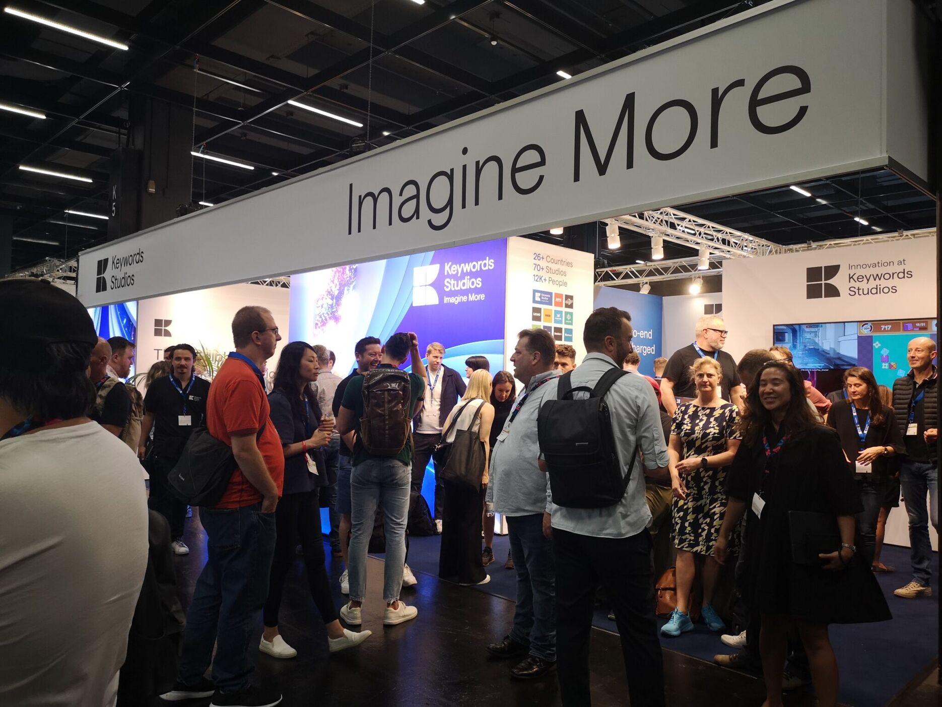 The Keywords GamesCom booth surrounded by people looking around