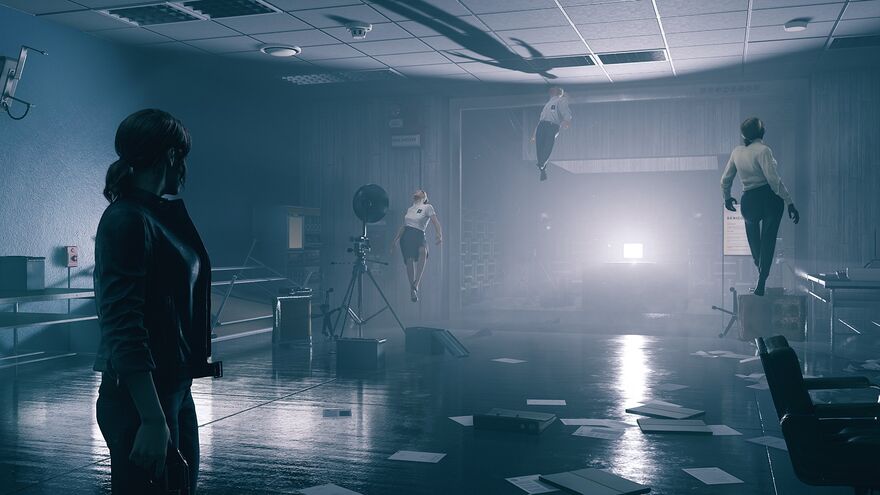 Room with a bright white light by the far wall with several people floating