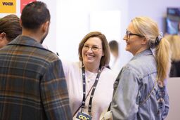 Two women smiling and talking at GDC