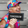 Ken from Barbie Movie holding a sign that says tomorrow