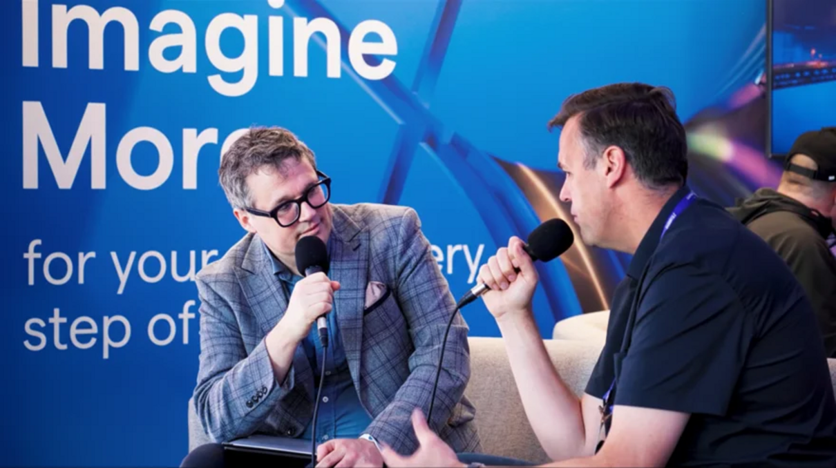 Jon Gibson at GDC holding a microphone