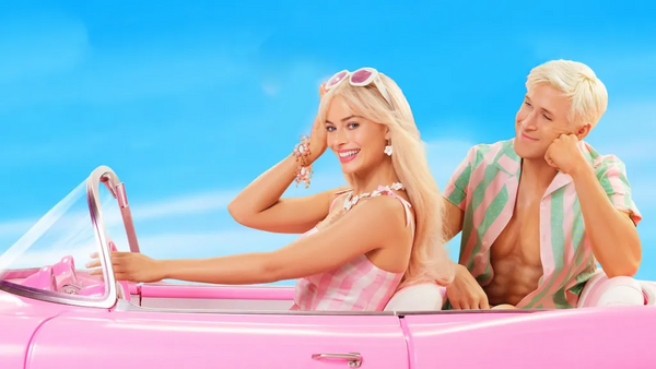 Barbie and Ken sitting in a convertible