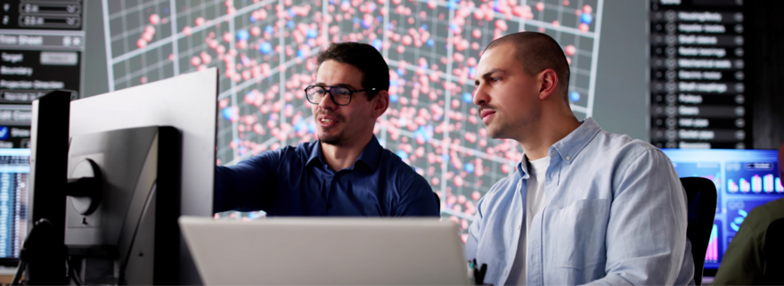 Two people looking at a computer screen