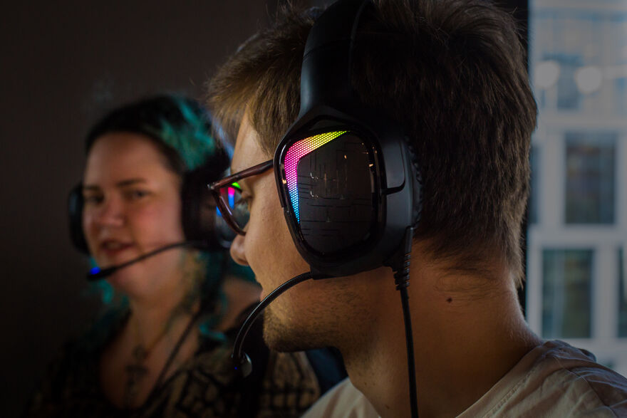 Two people wearing headsets