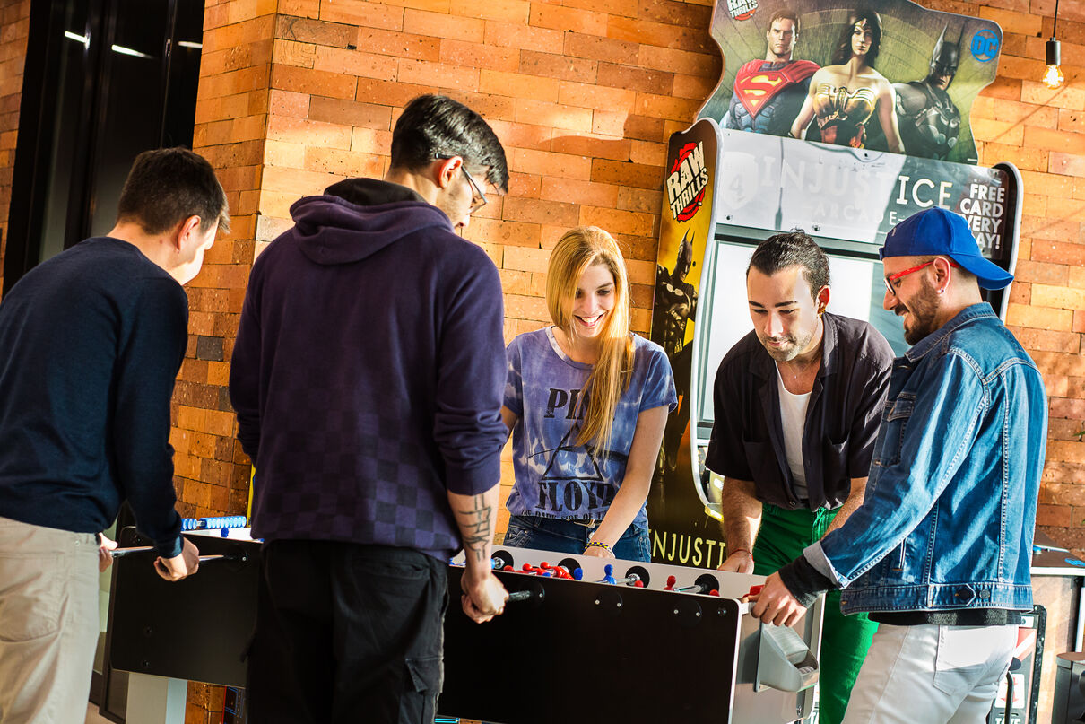 5 people playing table football