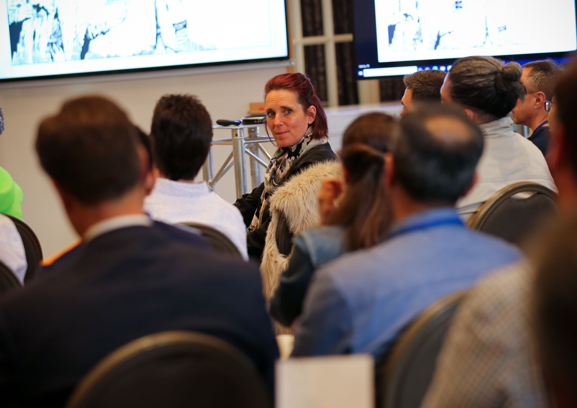 Group of people watching presentation